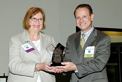 Chris Stracco, as Chair of the Board of Trustees of the IOLTA Fund of the Bar of New Jersey, presented a Special Achievement Award to Ellen Ferrise, the retiring Executive Director of the IOLTA Fund, for Ellen's lengthy and dedicated service to the IOLTA Fund.